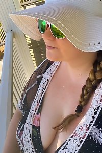 large super-sexy lady in underwear vigorously smooching a man